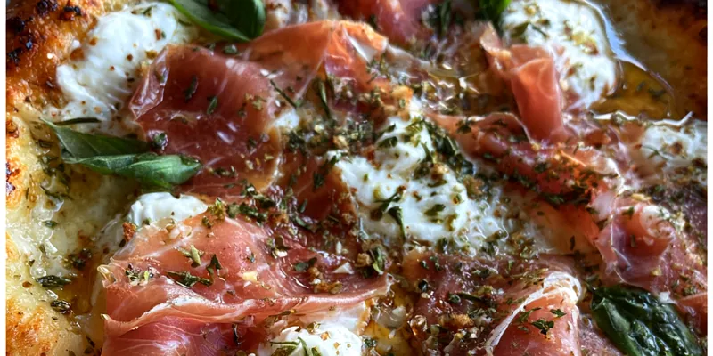 Delicious Prosciutto Honey Basil Pizza served on a plate
