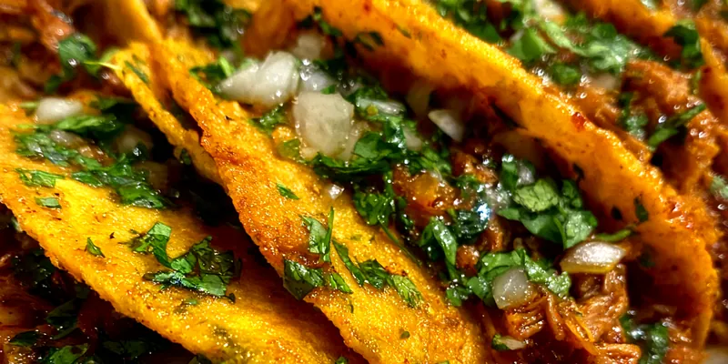 Delicious Slow Cooked Beef Tacos served on a plate