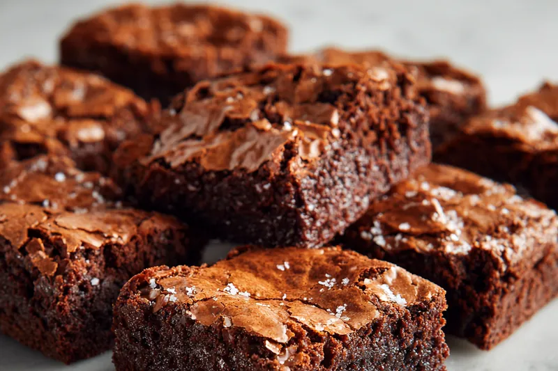 Melting white chocolate for coating the truffles in a bowl.