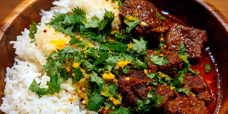 Delicious Tender Indian Beef Curry with Basmati served on a plate